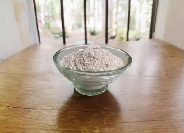 A bowl of on a table, labeled 'Ragi Milk Powder-Ragi PAAL