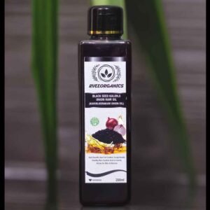 Bottle of Rveeorganics Karimjeerakam Onion Hair Oil with natural ingredients displayed